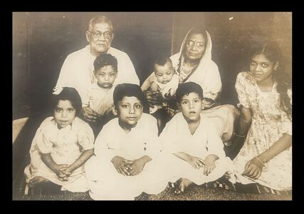 Grandfather, Prafulla and Grandmother Prafullabala with their grandchildren