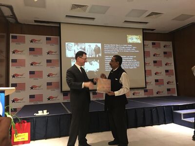 America — Calcutta Connect | American Consul General handing over a book