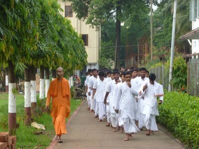 Swami Ekachittananda (Bhargav Maharaj), Vice Principal of the College guiding the students from the hostel to the Vidyamandir.