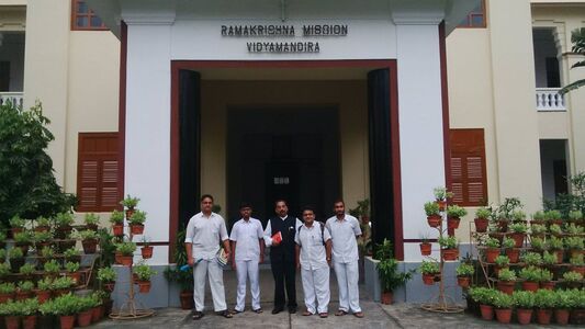 With students in front of the entrance